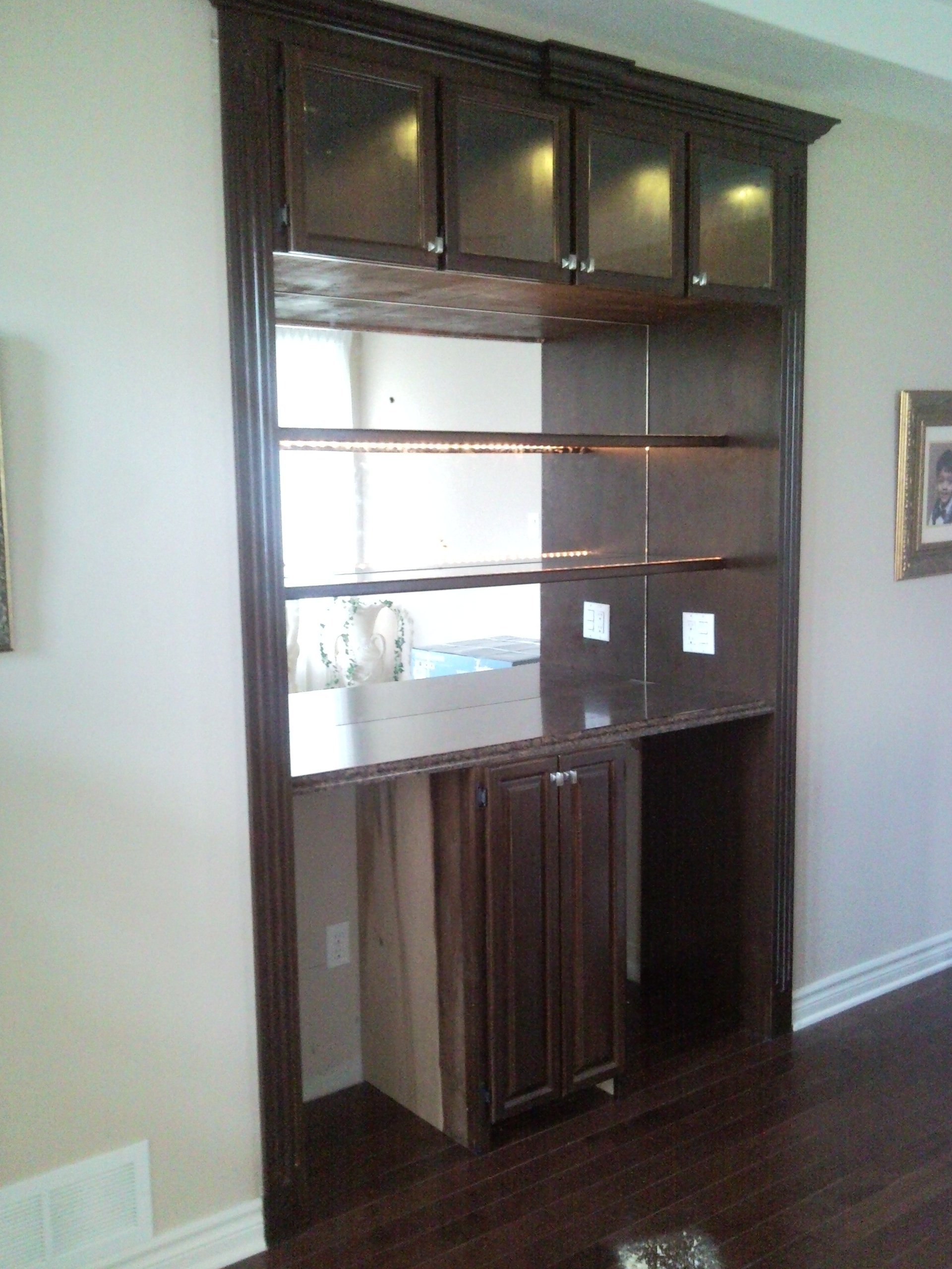 Built-in bar with glass doors